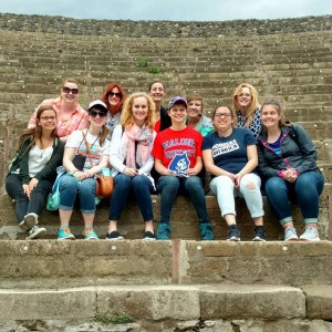 group of people sitting on steps