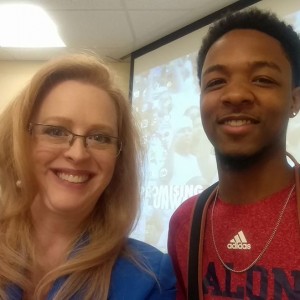 Teacher and student smiling