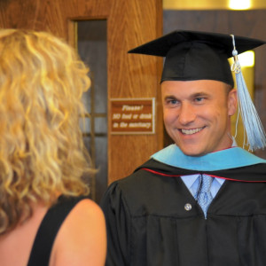 man with graduation cap and gown