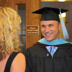 man with graduation cap and gown