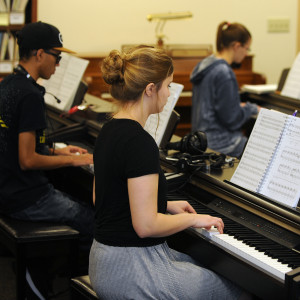students playing piano