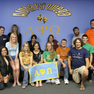 Group of people holding APO sign