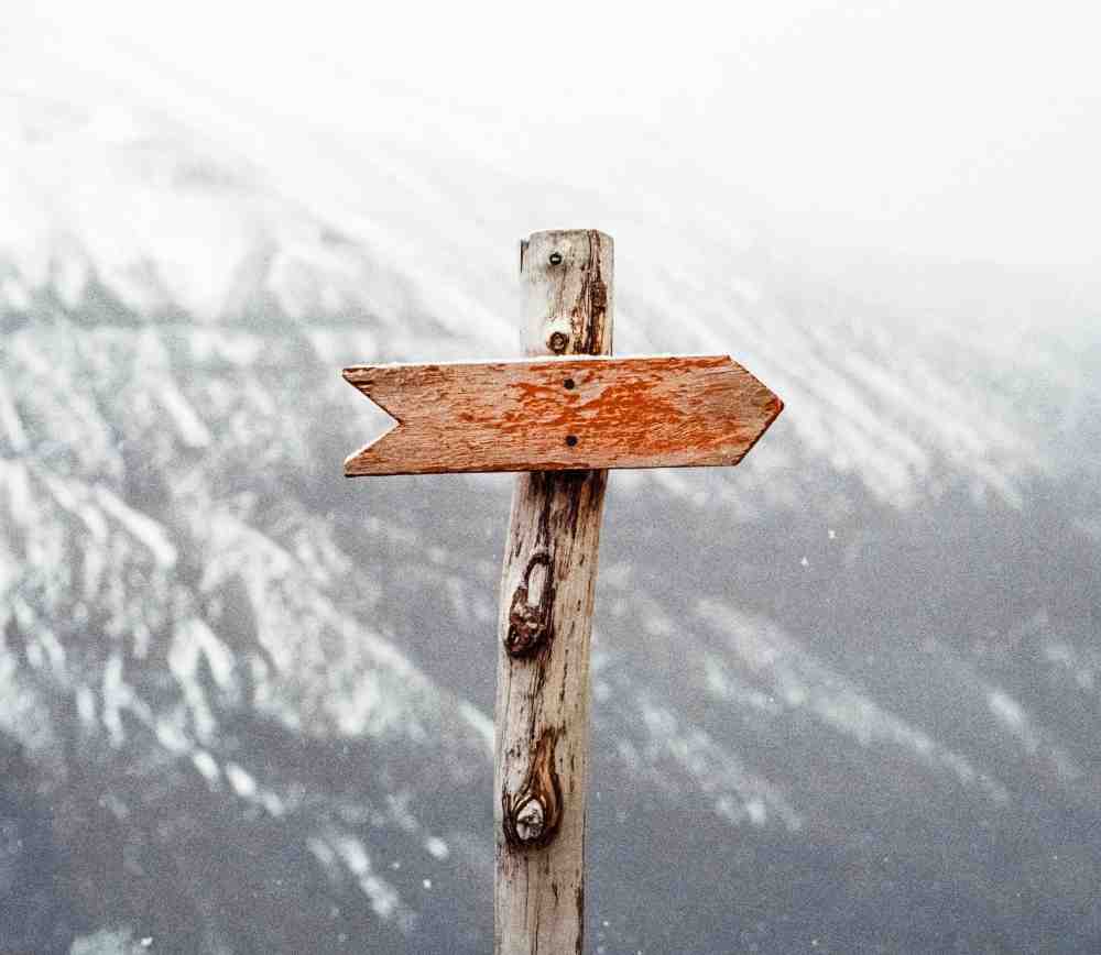 Arrow on a wooden post